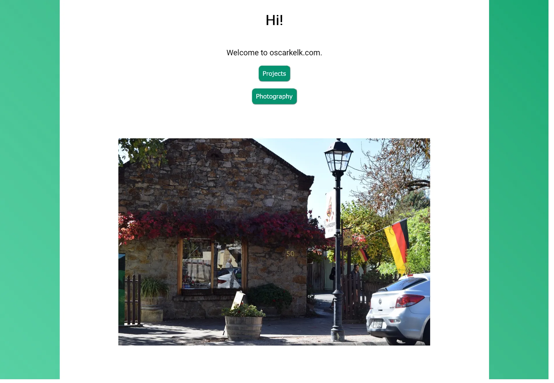 Version 3 of oscarkelk.com's home page, with its green buttons and featured picture taken in Hahndorf, SA